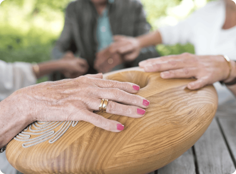 three unrecognizable elderly people holding crdl